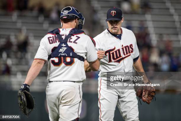 Matt Belisle of the Minnesota Twins celebrates with Chris Gimenez against the Chicago White Sox on August 29, 2017 at Target Field in Minneapolis,...