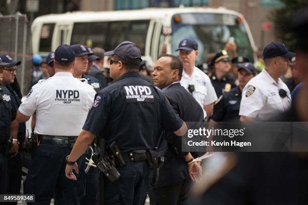 Congress member Luis Gutierrez is led away in handcuffs after participating in an action of civil disobedience near Trump Tower on September 19, 2017...