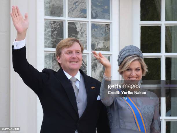 King Willem-Alexander and Queen Maxima of the Netherlands wave at the balcony of Palace Noordeinde during the Prinsjesdag on September 19, 2017 in...