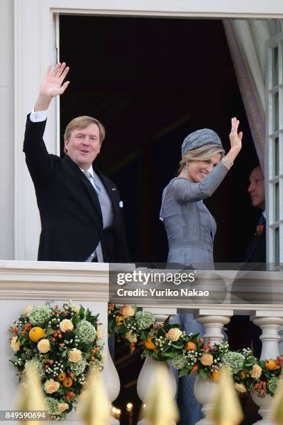 King Willem-Alexander and Queen Maxima of the Netherlands wave at the balcony of Palace Noordeinde during the Prinsjesdag on September 19, 2017 in...