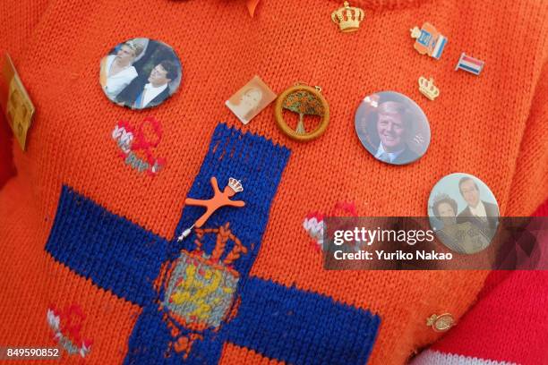 Man's sweater with brooches of the Dutch King Willem-Alexander, Queen Maxima and other royal families, is pictured ahead of the Prinsjesdag in front...