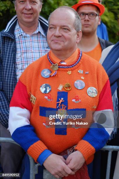 Man wearing a sweater with brooches of the Dutch King Willem-Alexander, Queen Maxima and other royal families, is pictured ahead of the Prinsjesdag...