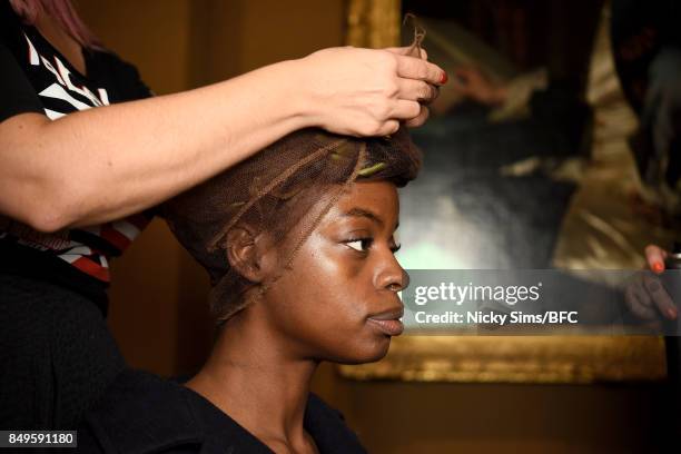 Model prepares backstage ahead of the Tata Naka presentation during London Fashion Week September 2017 on September 19, 2017 in London, England.