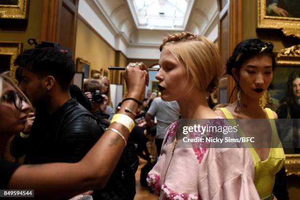 Model prepares backstage ahead of the Tata Naka presentation during London Fashion Week September 2017 on September 19, 2017 in London, England.