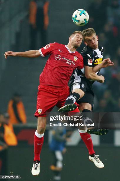 Simon Terodde of Stuttgart fights for the ball with Matthias Ginter of Moenchengladbach during the Bundesliga match between Borussia Moenchengladbach...