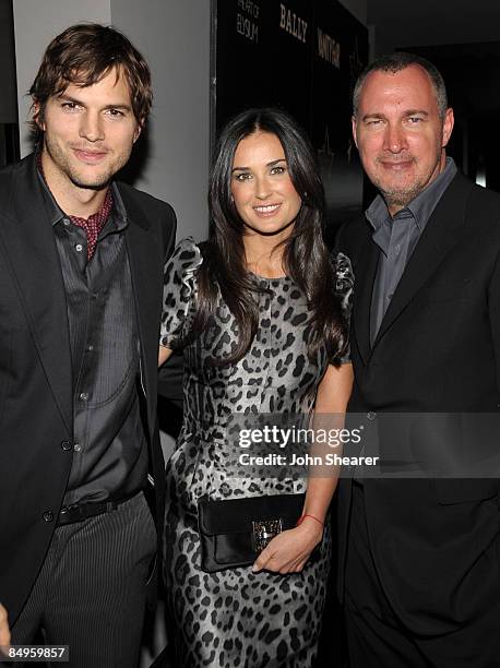 Actor Ashton Kutcher, actress Demi Moore and Vanity Fair publisher Edward Menicheschi arrive at the Bally and Vanity Fair Hollywood Domino Game Night...