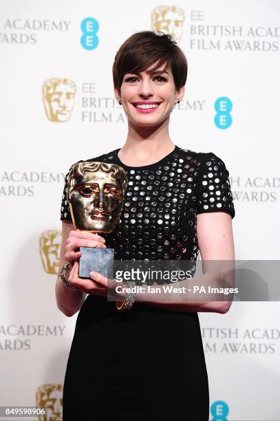 Anne Hathaway with the award for Best Supporting Actress for 'Les Miserables' in the press room at the 2013 British Academy Film Awards at the Royal...