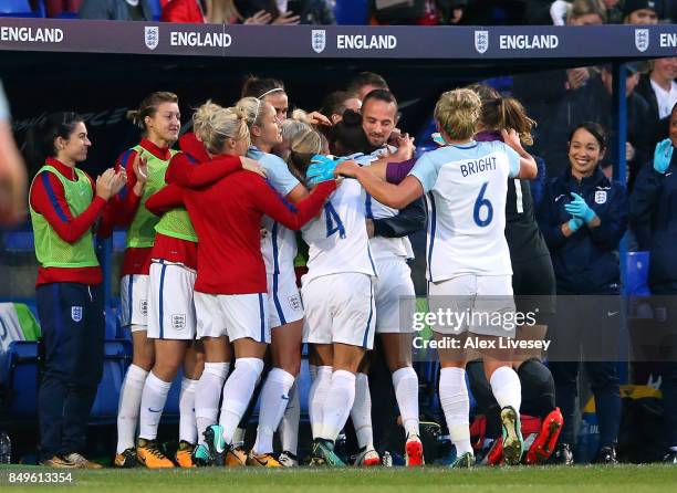 Nikita Parris of England celebrates with Mark Sampson the manager of England after scoring the opening goal during the FIFA Women's World Cup...