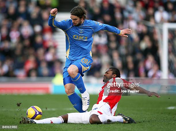 Niko Kranjcar of Portsmouth competes against Salif Diao of Stoke City during the Barclays Premier League match between Stoke City and Portsmouth at...