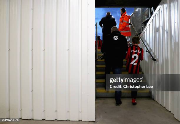 Two AFC Bournemouth fans make there way to their seats prior to the Carabao Cup Third Round match between AFC Bournemouth and Brighton and Hove...