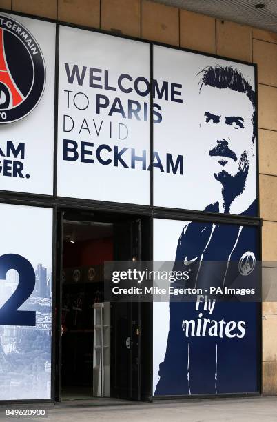 David Beckham signs hang outside the Paris Saint-Germain Club shop on The Champs-Elysees, Paris reading 'Welcome To Paris'