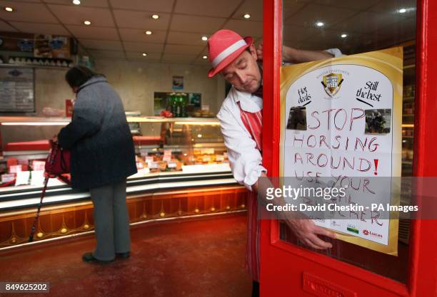 George Emond of Halliwells Selkirk in the Scottish Borders puts up his posters advertising local butchers as the horsemeat found in beef products...