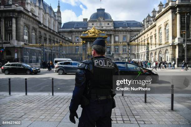 Policeman outside Trail in Paris, France, on 19 September 2017 during opening of the trial in the Quai de Valmy case, where a police car was set on...