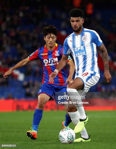 Chung-yong Lee of Crystal Palace and Philip Billing of Huddersfield Town battle for possession during the Carabao Cup Third Round match between...