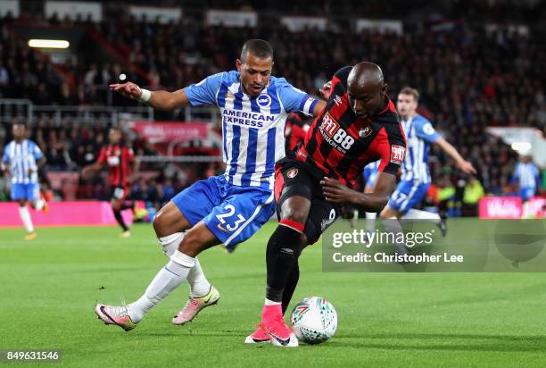 Liam Rosenior of Brighton and Hove Albio and Benik Afobe of AFC Bournemouth battle for possession during the Carabao Cup Third Round match between...