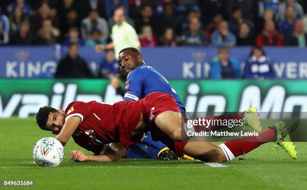 Wes Morgan of Leicester City tackles Dominic Solanke of Liverpool during the Carabao Cup Third Round match between Leicester City and Liverpool at...