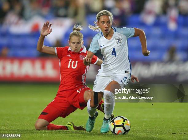 Jordan Nobbs of England beats Nadezhda Smirnova of Russia during the FIFA Women's World Cup Qualifier between England and Russia at Prenton Park on...