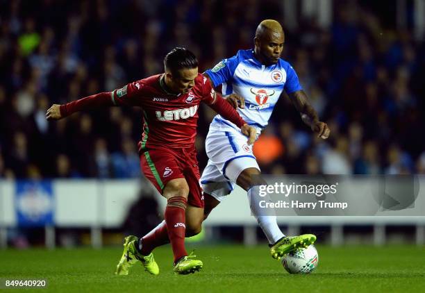 Roque Mesa of Swansea City and Leandro Bacuna of Reading battle for possession during the Carabao Cup Third Round match between Reading and Swansea...