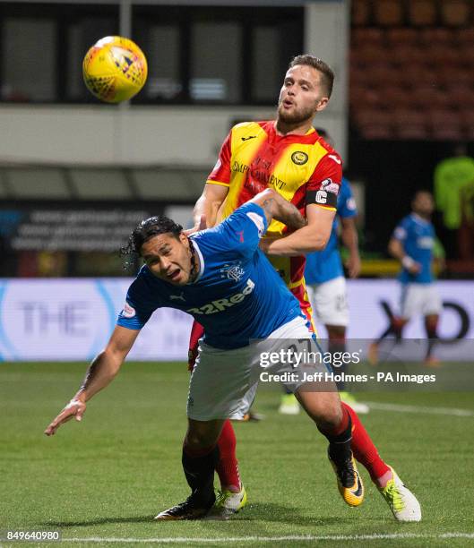 Partick Thistle's Daniel Devine and Rangers' Carlos Pena battle for the ball during the Betfred Cup, Quarter Final match at the Firhill Stadium,...