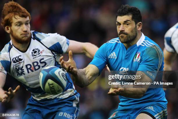 Italy's Andrea Masi and Scotland's Robert Harley in action