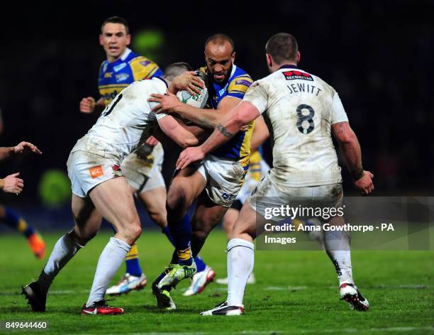 Leeds Rhinos' Jamie Jones-Buchanan is tackled by Salford City Reds' Adam Neal during the Super League match at Headingley Carnegie, Leeds.