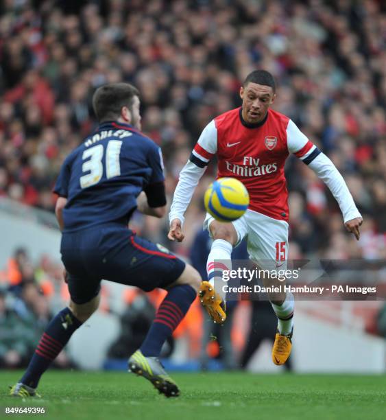 Arsenal's Alex Oxlade-Chamberlain and Blackburn's Grant Hanley during the FA Cup fifth round match at The Emirates Stadium, London.