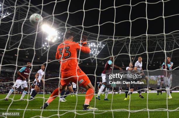 Angelo Ogbonna of West Ham United scores his sides first goal past Mark Howard of Bolton Wanderers during the Carabao Cup Third Round match between...