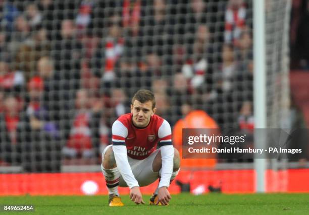 Arsenal's shows his dejection after the FA Cup fifth round match at The Emirates Stadium, London.