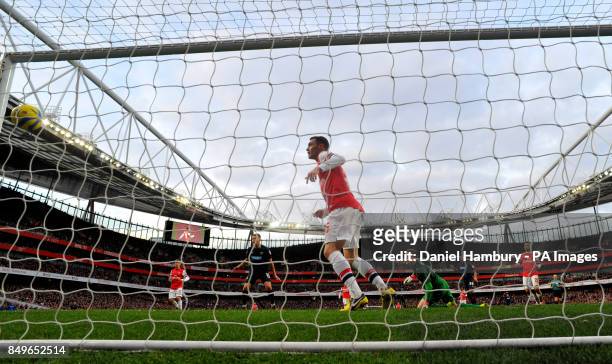 Arsenal's Thomas Vermaelen watches as the shot of Blackburn's Colin Kazim-Richards creeps in the far post during the FA Cup fifth round match at The...