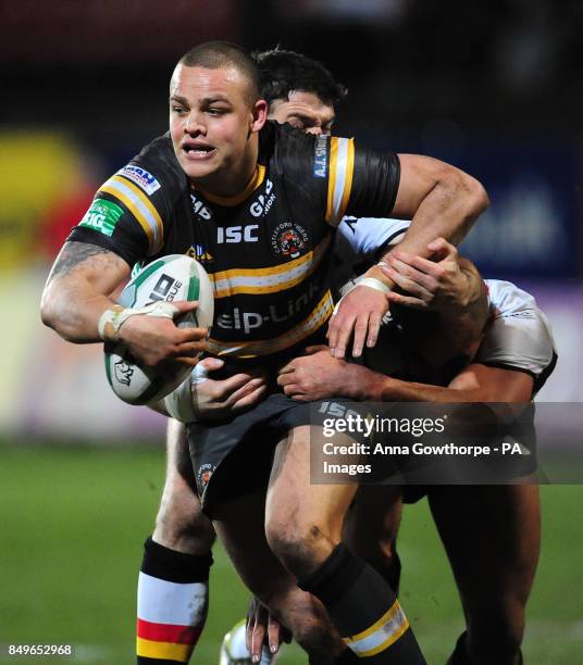 Castleford Tigers' Jordan Tansey is tackled by Bradford Bulls' Matt Diskin and Chev Walker during the Super League match at the Provident Stadium,...