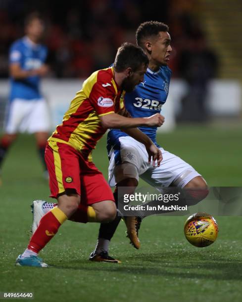 Steven Lawless of Partick Thistle vies with James Tavernier of Rangers during the Betfred League Cup Quarter Final at Firhill Stadium on September...