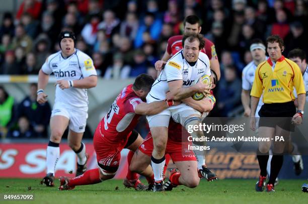 Sale Sharks' Henry Thomas is tackled by London Welsh's Paulica Ion and Franck Montanella during the Aviva Premiership match at the Kassam Stadium,...