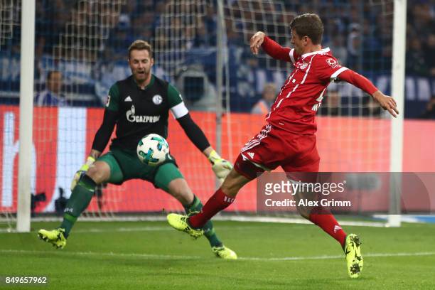 Thomas Mueller of Bayern Muenchen misses a chance against goalkeeper Ralf Faehrmann of Schalke during the Bundesliga match between FC Schalke 04 and...