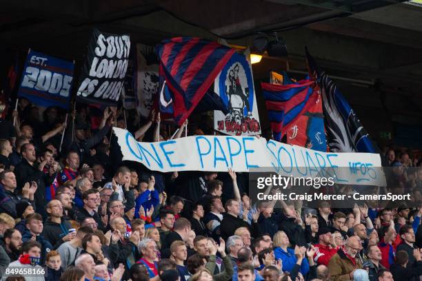 Fans show their support for Crystal Palace's Pape N'Diaye Souare during the Carabao Cup Third Round match between Crystal Palace and Huddersfield...