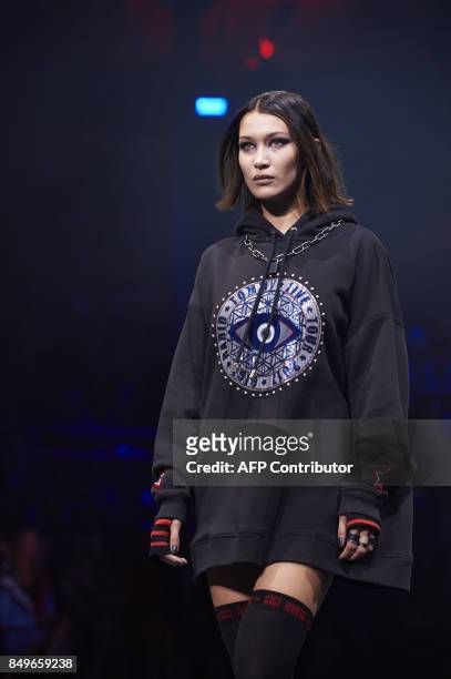 Model Bella Hadid presents a creation by US designer Tommy Hilfiger during a catwalk show for the Spring/Summer 2018 collection on the fifth and...