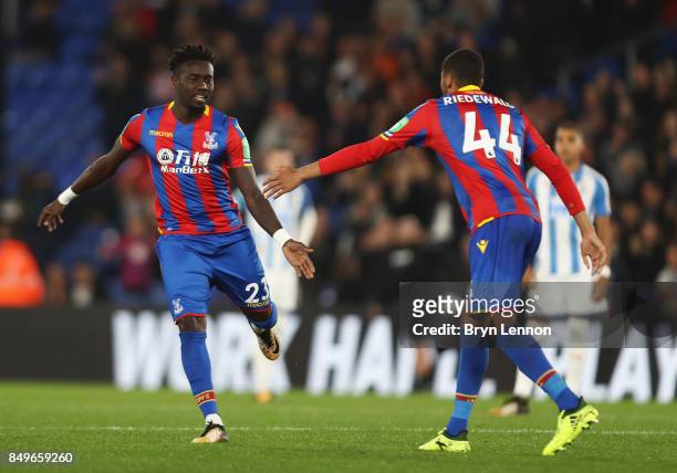 Pape Souare of Crystal Palace celebrates with Jairo Riedewald of Crystal Palace after coming on the pitch during the Carabao Cup Third Round match...