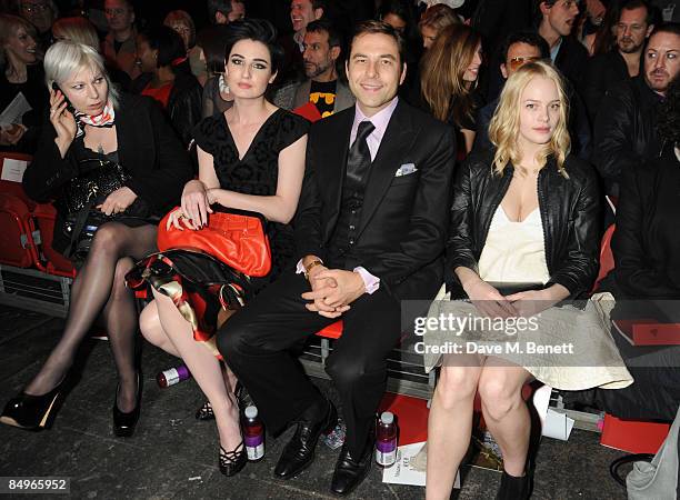 Erin O'Connor, David Walliams and Annabelle Horsey pose in the front row for Vivienne Westwood Red Label show during the London Fashion Week a/w...