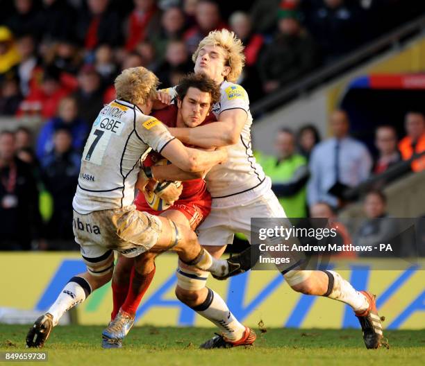 London Welsh's Gonzalo Tiesi is tackled by Sale Sharks' David Seymour during the Aviva Premiership match at the Kassam Stadium, Oxford.