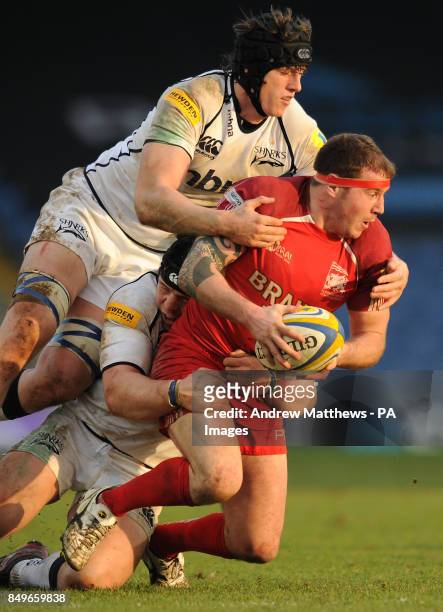 Sale Sharks' James Gaskell and Alasdair Dickinson tackle London Welsh's Neil Briggs during the Aviva Premiership match at the Kassam Stadium, Oxford.
