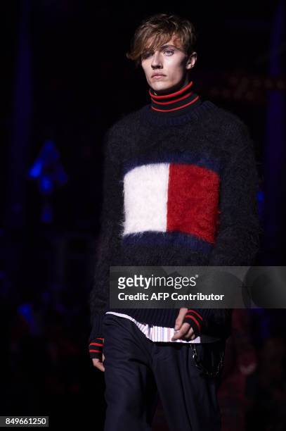 Model presents a creation by US designer Tommy Hilfiger during a catwalk show for the Spring/Summer 2018 collection on the fifth and final day of The...