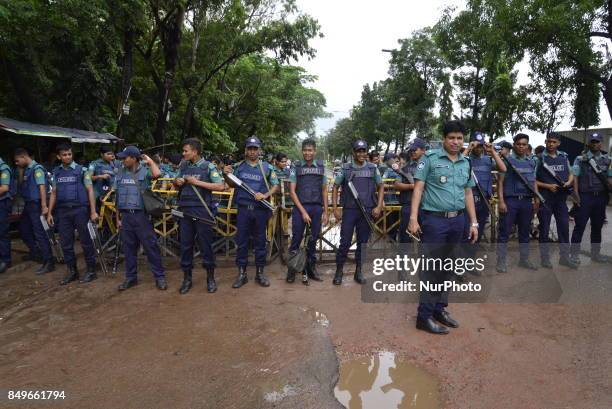 Bangladeshi Policeperson stands guard in front of Dhaka's United Nation Office during Peoples' Solidarity Movement party's activist demonstration...