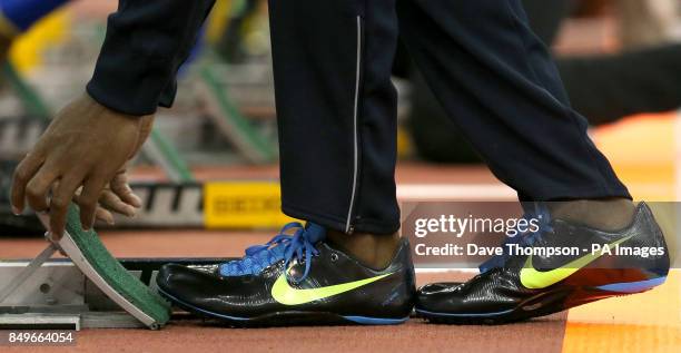 Close up of an Dwaine Chambers Nike running spikes as he sets up his starting blocks during the British Athletics Grand Prix at the National Indoor...
