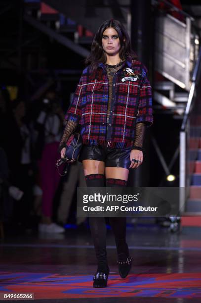 Model presents a creation by US designer Tommy Hilfiger during a catwalk show for the Spring/Summer 2018 collection on the fifth and final day of The...