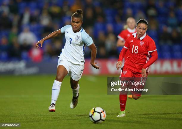 Nikita Parris of England beats Elvira Ziyastinova of Russia during the FIFA Women's World Cup Qualifier between England and Russia at Prenton Park on...