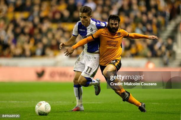 Jack Price of Wolverhampton Wanderers competes with Tom Nicholls of Bristol City during the Carabao Cup tie between Wolverhampton Wanderers and...