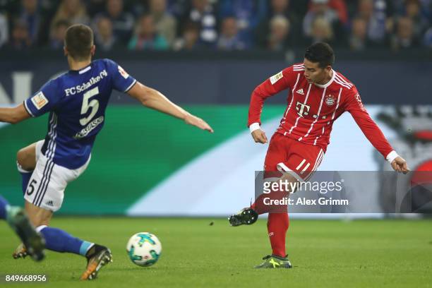 James Rodriguez of Bayern Muenchen shoots to score his teams second goal to make it 2:0 during the Bundesliga match between FC Schalke 04 and FC...