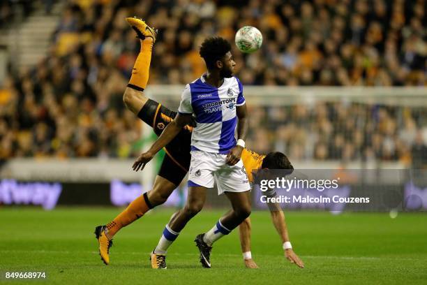 Ellis Harrison of Bristol Rovers competes with Danny Batth of Wolverhampton Wanderers during the Carabao Cup tie between Wolverhampton Wanderers and...