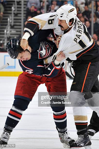 George Parros of the Anaheim Ducks lands a punch on the side of the head of Jared Boll of the Columbus Blue Jackets on February 21, 2009 at...