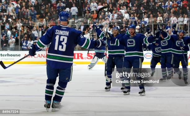 Mats Sundin of the Vancouver Canucks celebrates his shootout winning goal against his former team the Toronto Maple Leafs during their NHL game at...