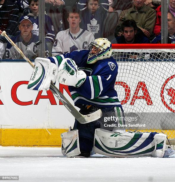 Roberto Luongo of the Vancouver Canucks makes a save against the Toronto Maple Leafs during their NHL game at the Air Canada Centre February 21, 2009...